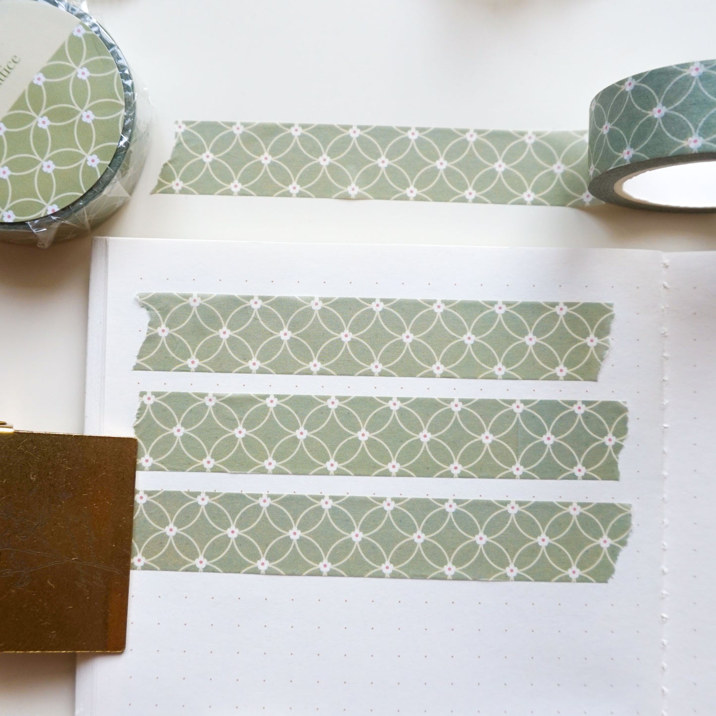 a washi tape with coin lattice pattern in light green.