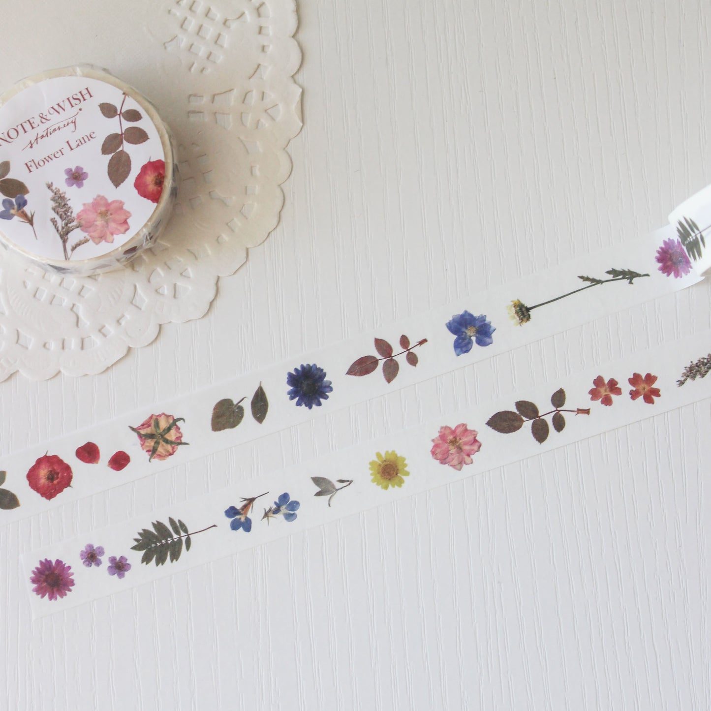 Decorative tape with floral designs on a textured surface
