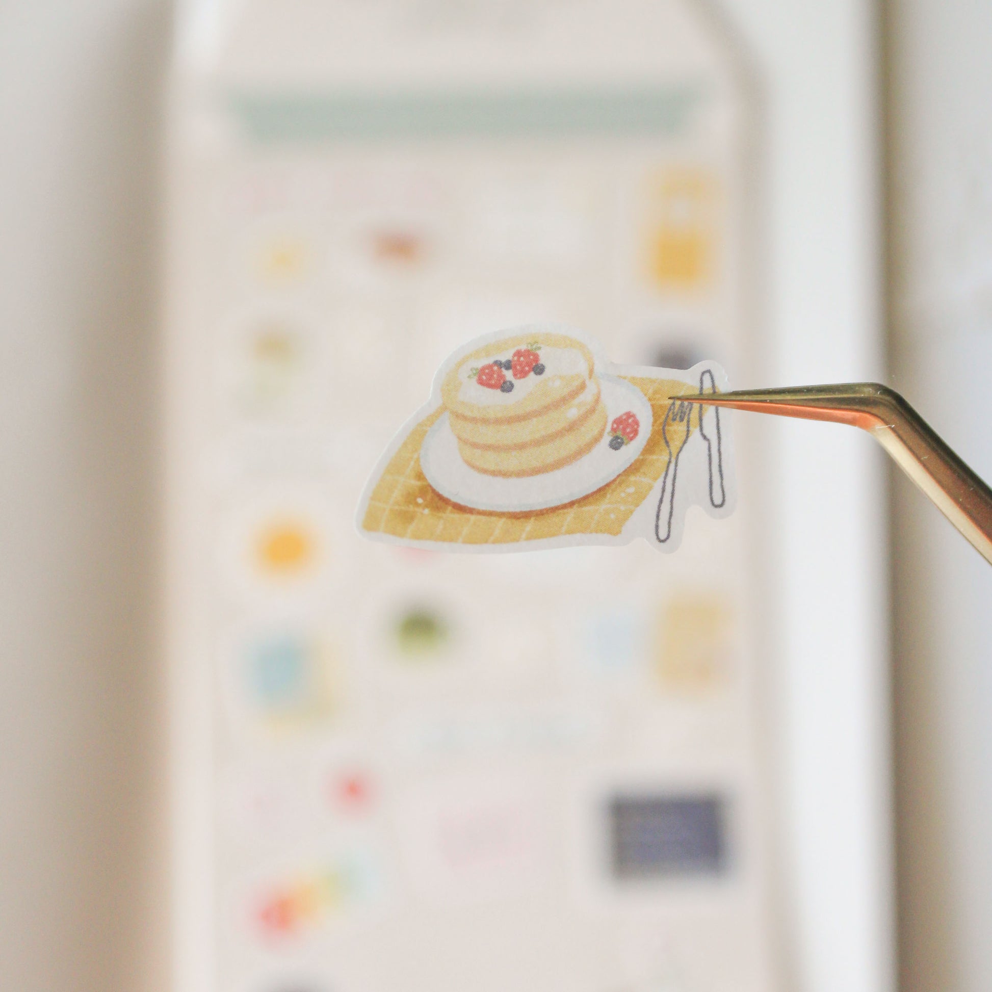 closeup of pancake illustration with strawberries and knife and fork