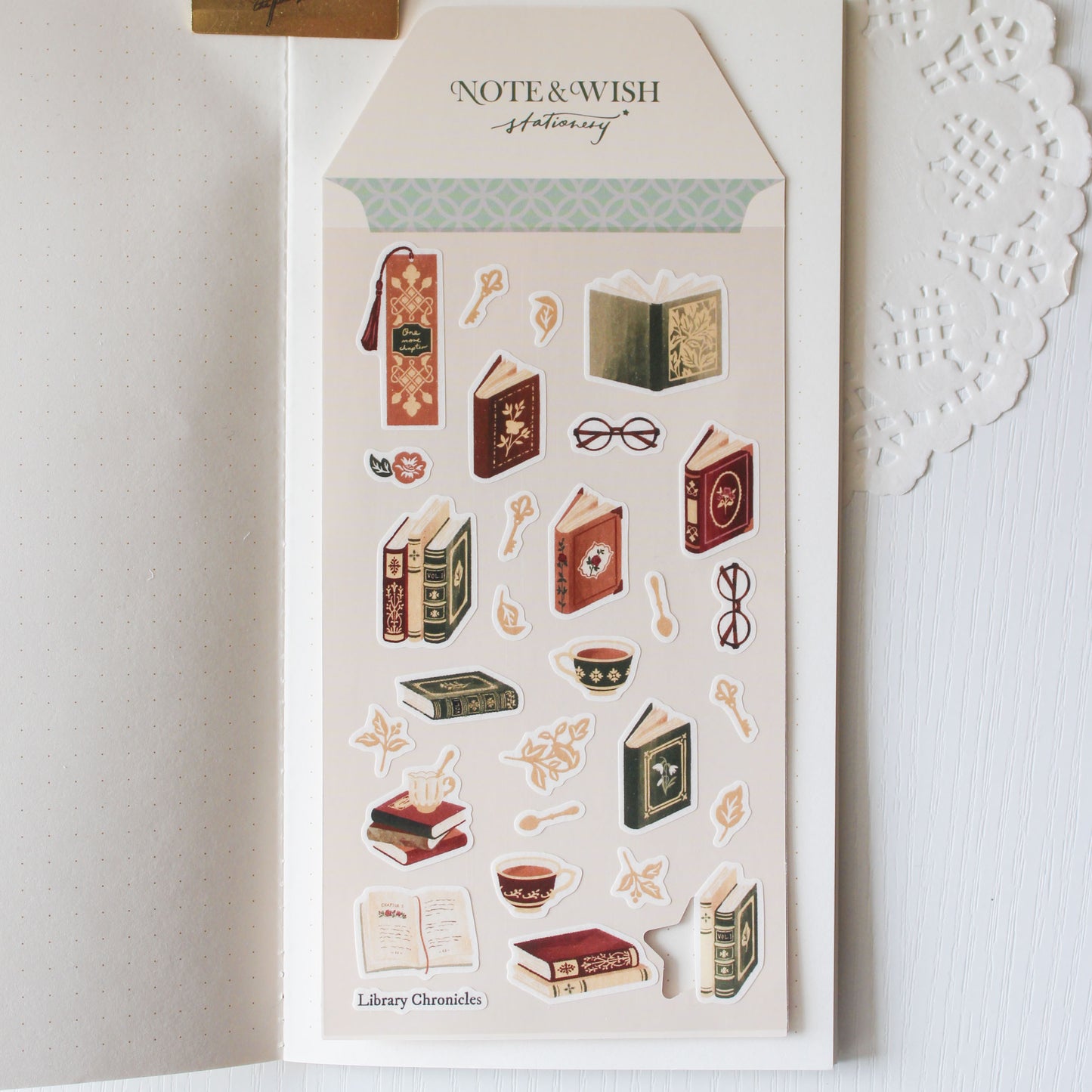 Hand drawn vintage book and delicate teacup illustrations on dark academia washi sticker sheet