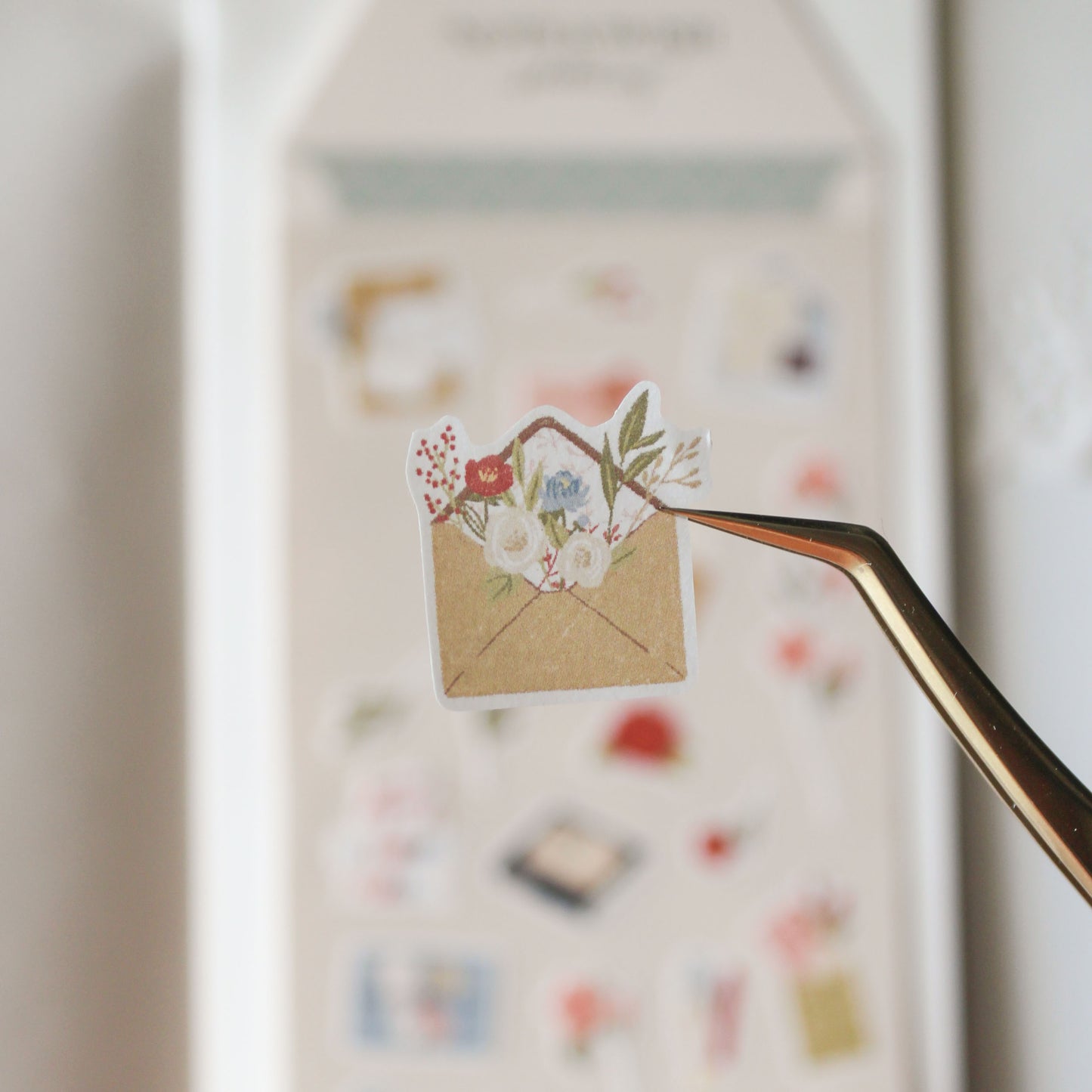 close up of sticker illustration of a floral envelope with flowers