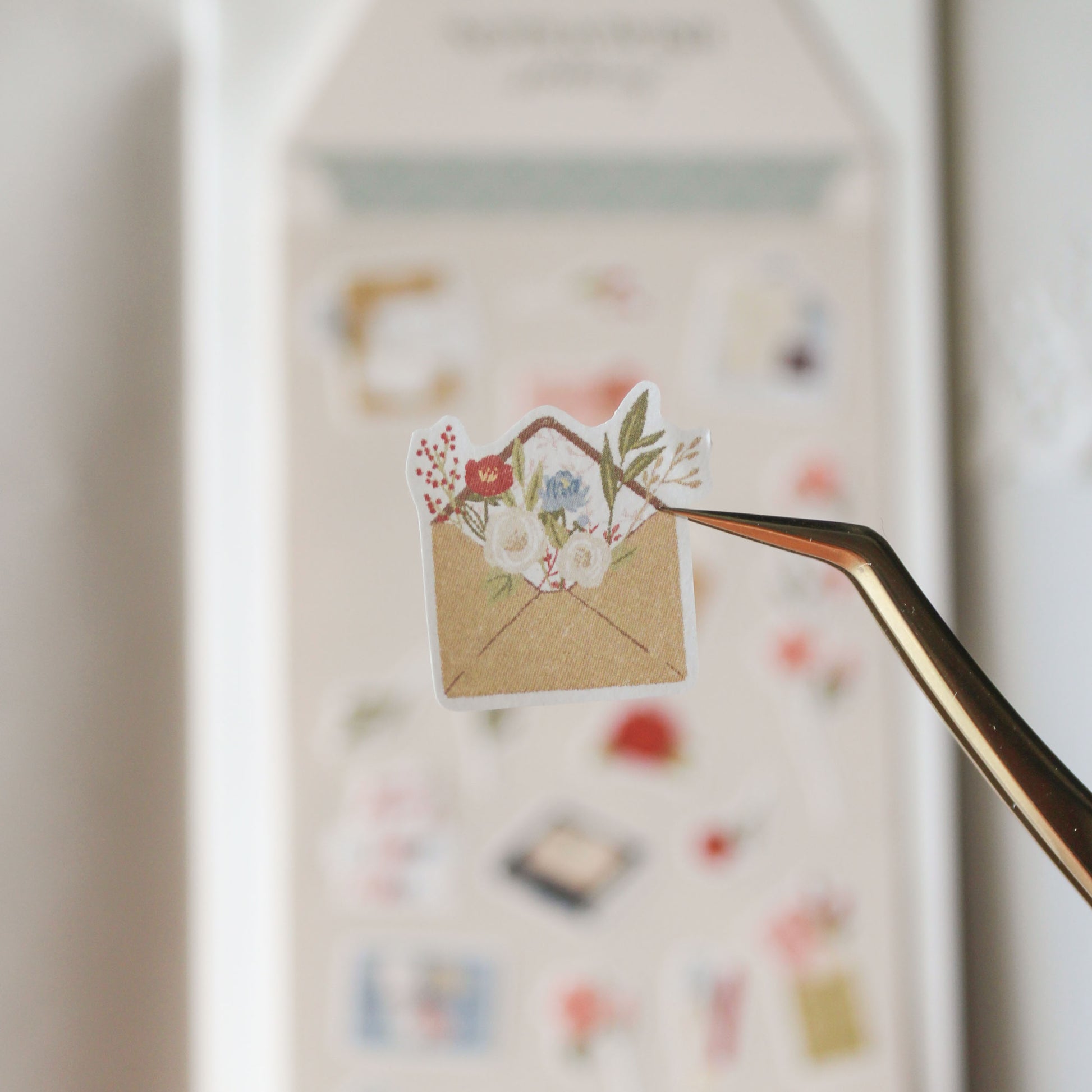 close up of sticker illustration of a floral envelope with flowers