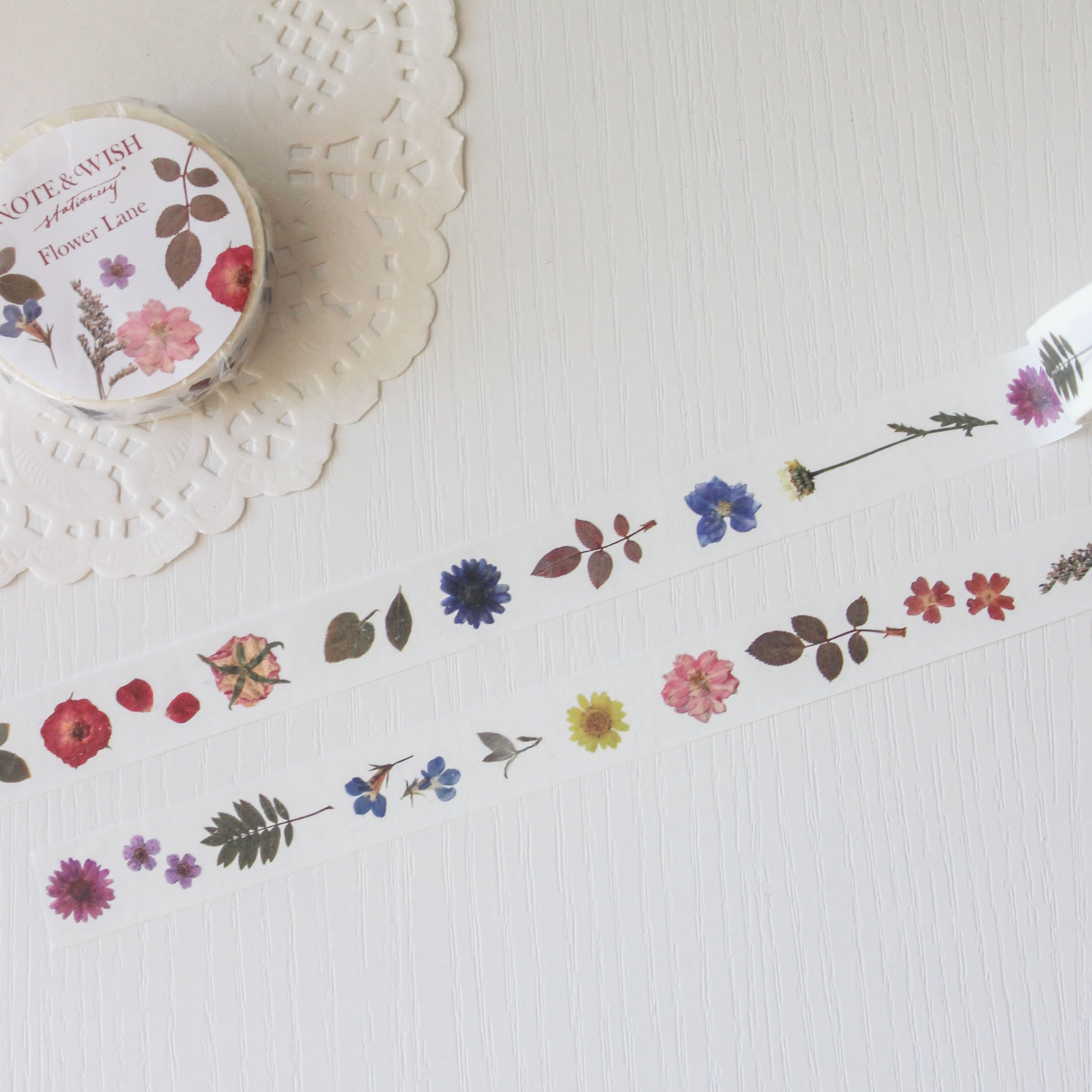 Decorative tape with floral designs on a textured surface
