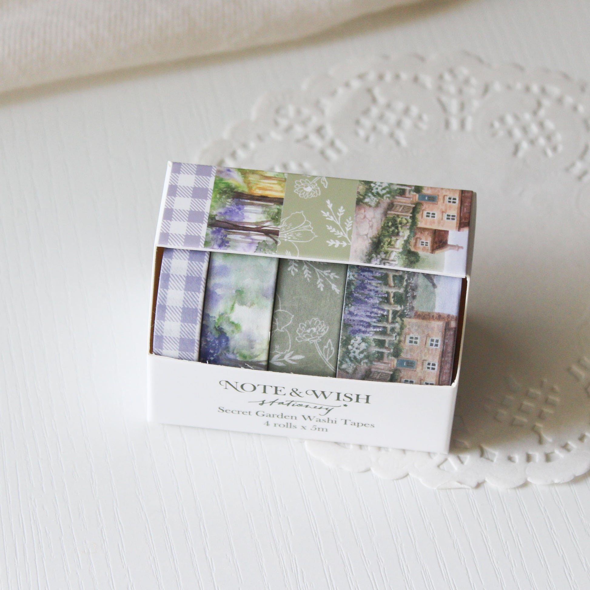 Pack of washi tapes with scenic designs in a box