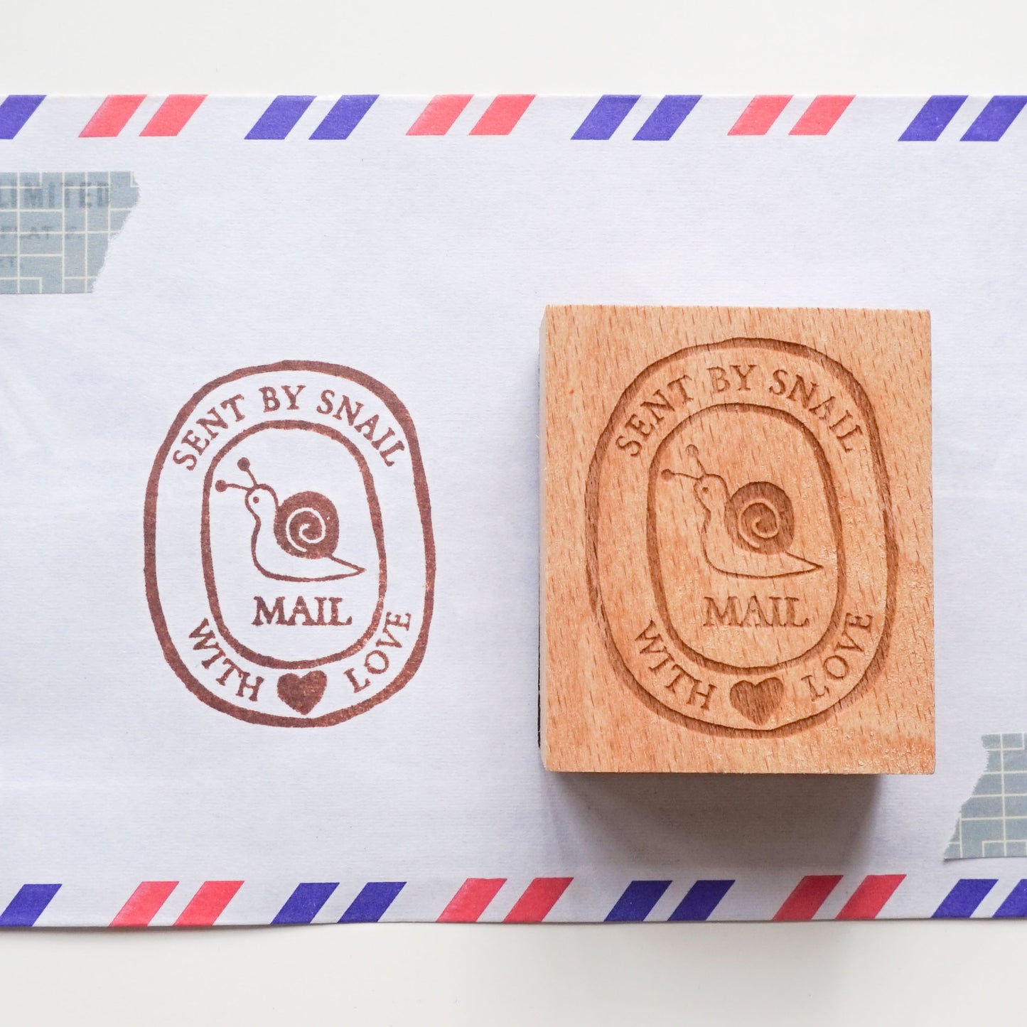 Hand-drawn snail mail rubber stamp featuring a cute snail illustration. 